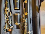 two clarinets in a case sitting on a table