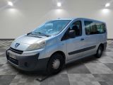 a picture of a silver van parked in a room