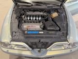 the engine of a car with its hood open and the hood up
