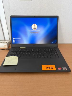 a laptop that is sitting on a desk with a price tag on it