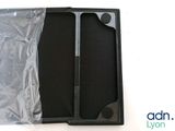 a black box with a pair of scissors inside of it