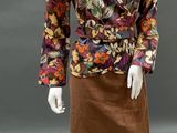 an image of a mannequin dressed in a floral shirt and skirt