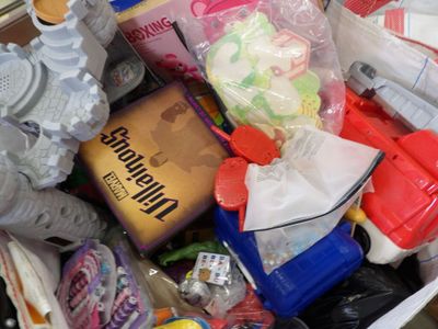 a basket full of toys and other items that are in it