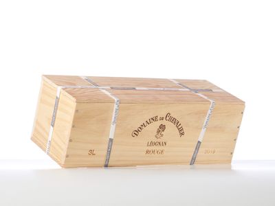 a wooden box with a wine bottle inside of it