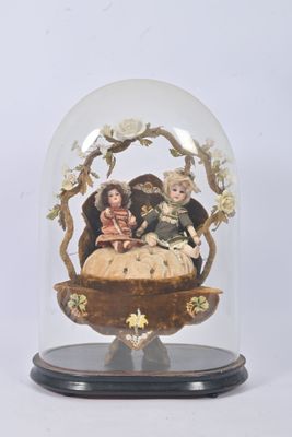 a glass dome with a figurine inside of it
