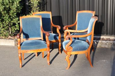 three chairs that are sitting in the parking lot