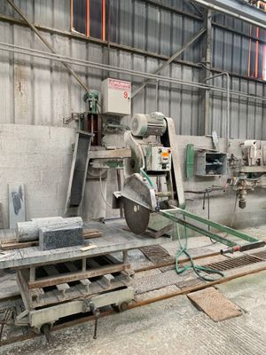 a machine that is working on a piece of wood