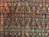 an antique persian rug with a blue and red design