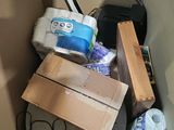 a cardboard box filled with toilet paper and other items