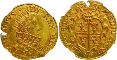 a close up of two gold coins on a white background