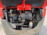a close up view of the engine of a red truck