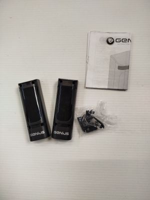 two black usb drives and a box on a white surface