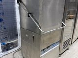 a stainless steel freezer sitting in a warehouse