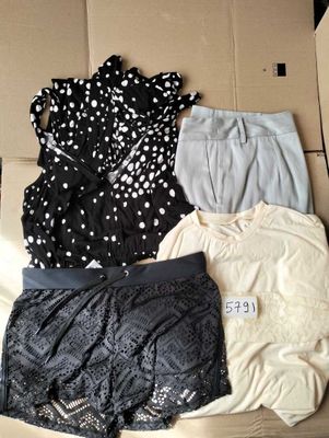 a cardboard box with a lot of clothes in it