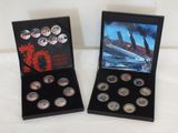 two boxes of silver coins with a picture of a ship in the background
