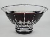 a glass bowl filled with liquid on top of a table