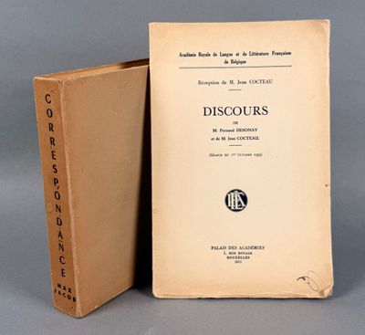 an old book sitting on top of a table next to a box