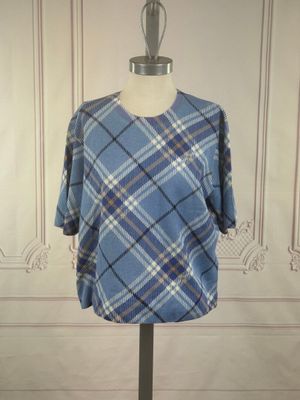 blue and white plaid shirt on a mannequin stand