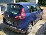 a blue car that is parked in a parking lot