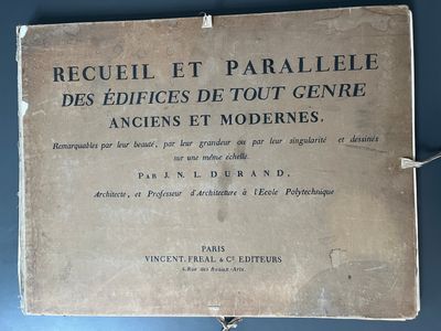 an old book with writing on it sitting on top of a table