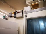 an image of a hospital room with a medical device on the wall