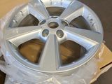 a wheel that is sitting on top of a cardboard box