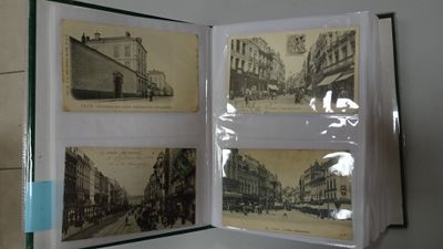 a picture of a book opened to show pictures of old buildings