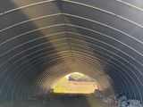 a large metal structure that has a lot of hay in it
