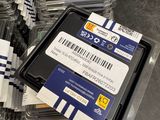 many packages of computer ram cards on a table