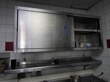 an image of a kitchen with a sink and a mirror