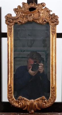 a man taking a picture of himself in a mirror