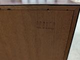 a close up of a piece of wood with a name engraved on it