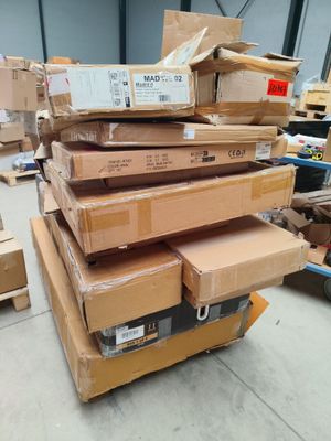 many boxes stacked on top of each other in a warehouse