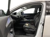the interior of a car with the door open and the driver ' s seat down