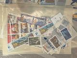 a bag of stamps sitting on top of a table