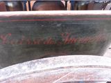 a large metal container with a red writing on it