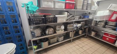 a kitchen with a lot of items on the shelves