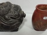 two vases sitting next to each other on a table