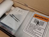 a box with some items in it and a sign on it