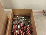 a cardboard box with a bunch of tools in it