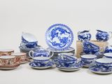 many blue and white china dishes and cups and saucers