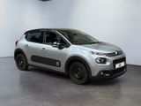 the silver citrole is parked in a white room