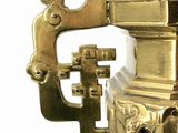a gold fire hydrant on a white background
