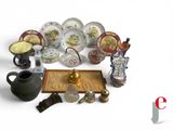 many different types of decorative items displayed on the table