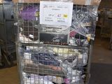 a metal cart with many items in it in a warehouse