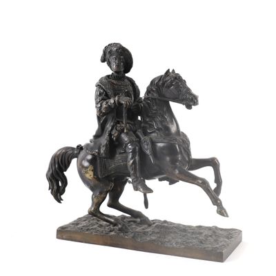 bronze statue of a man riding a horse with a helmet on his head