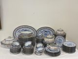 a lot of plates and cups on a table