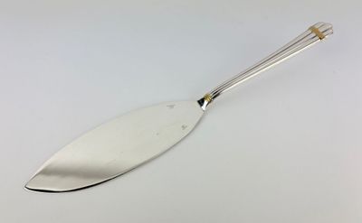 a close up of a spoon on a white surface