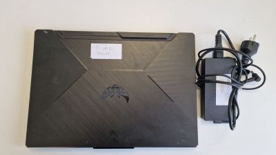 a black laptop with a power cord attached to it