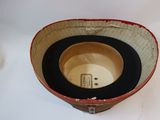a small bowl with a lid on a white table